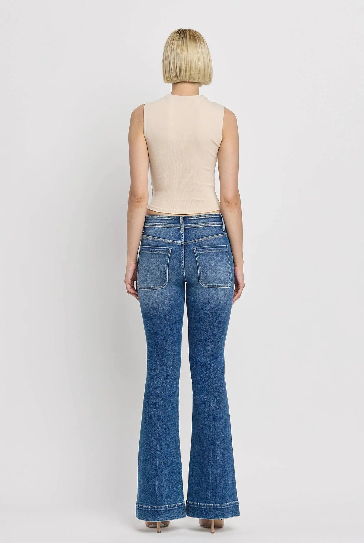 Vervet Alison mid rise flare jeans with trouser hem and patch pocket detail in blue color.