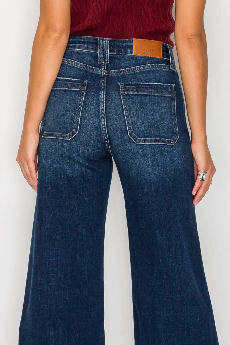 Artemis Vintage tummy-control high-rise A-line wide-leg jeans in dark stone wash, back view with pockets