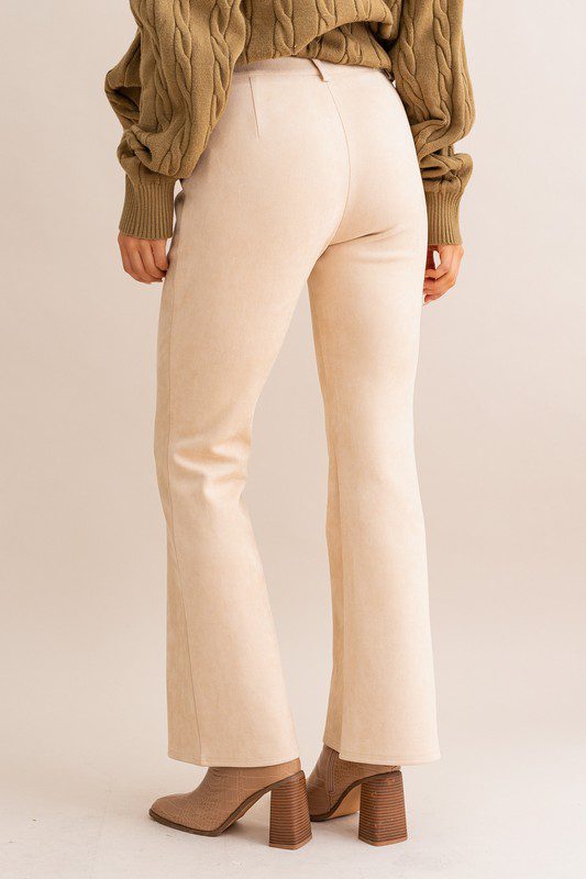 Beige suede flare pants and boots.