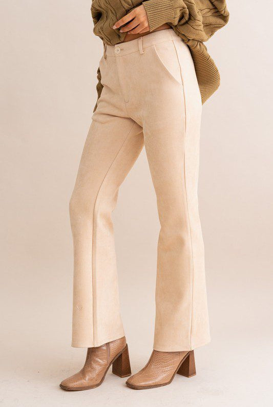 Beige suede flare pants and boots.