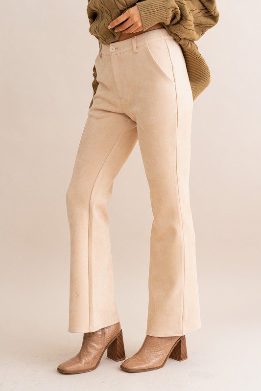 Beige suede flare pants and boots.