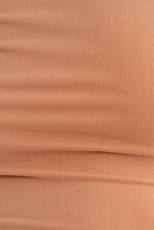 Close-up of light brown fabric texture.