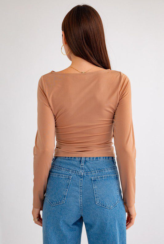 Brown long sleeve top, back view.