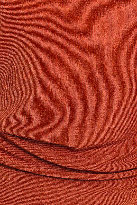Rust-colored ribbed fabric texture.