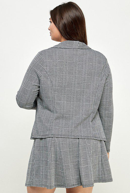 Grey plaid blazer and pleated skirt.