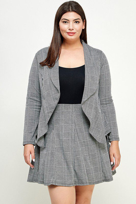 Plus-size woman in plaid blazer and skirt.