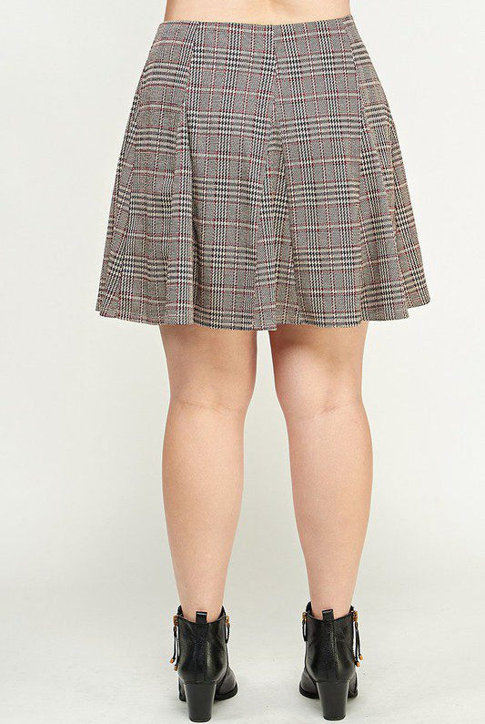 Plaid pleated mini skirt and boots.