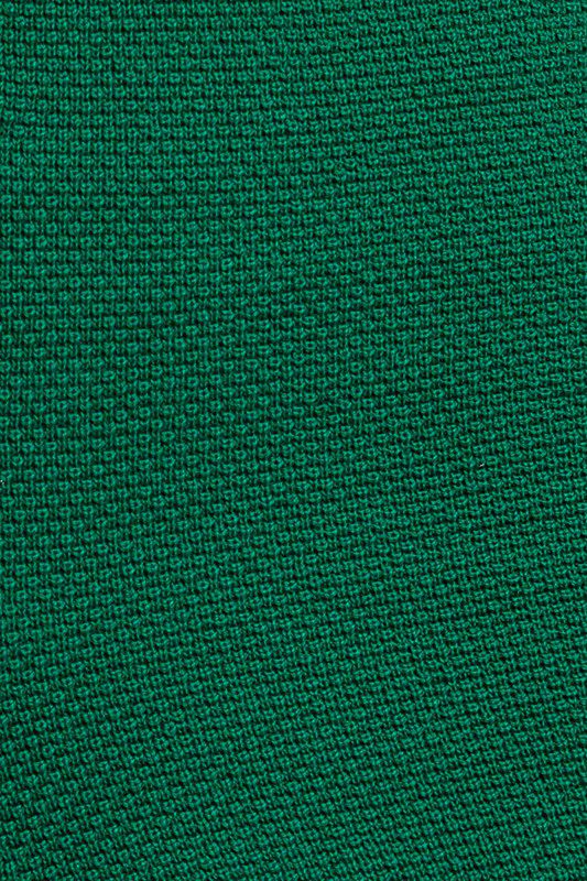 Here's an alt tag for the image: Dark green fabric texture.