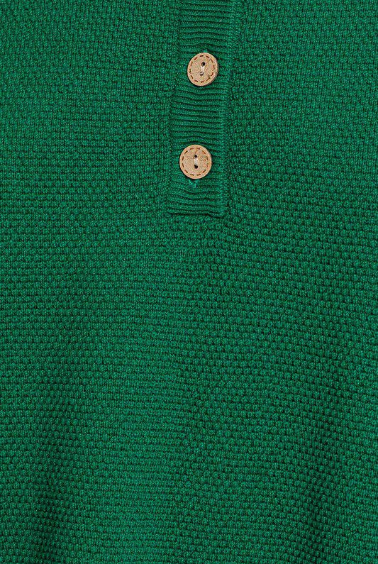 Green knitted sweater with buttons.