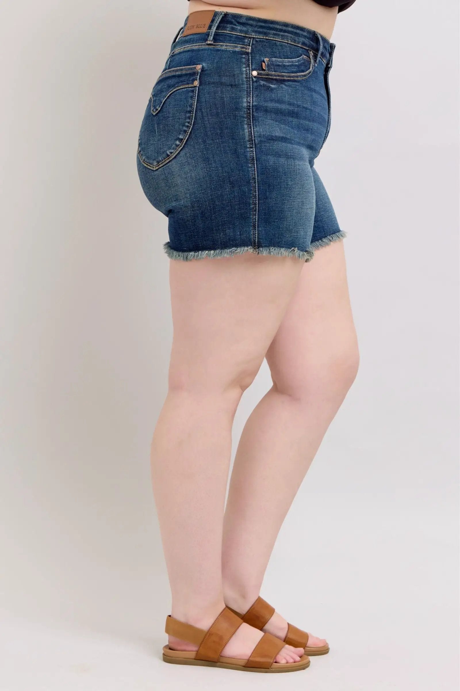 Judy Blue Judy Blue High Waisted Tummy Control Frayed Hem & Shield Back Pocket Dark Blue Denim Shorts PLUS - Shorts Judy Blue High Waisted Tummy Control Frayed Hem & Shield Back Pocket Dark Blue Denim Shorts PLUS