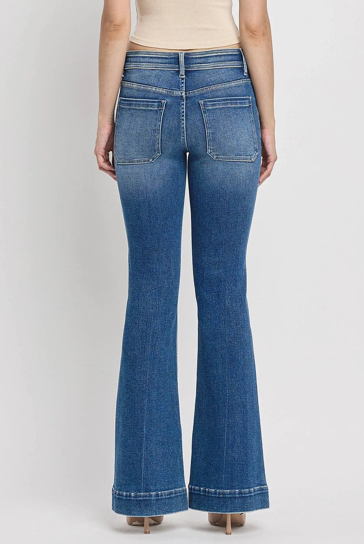 Back view of Vervet Alison mid-rise flare jeans featuring trouser hems and patch pockets in blue