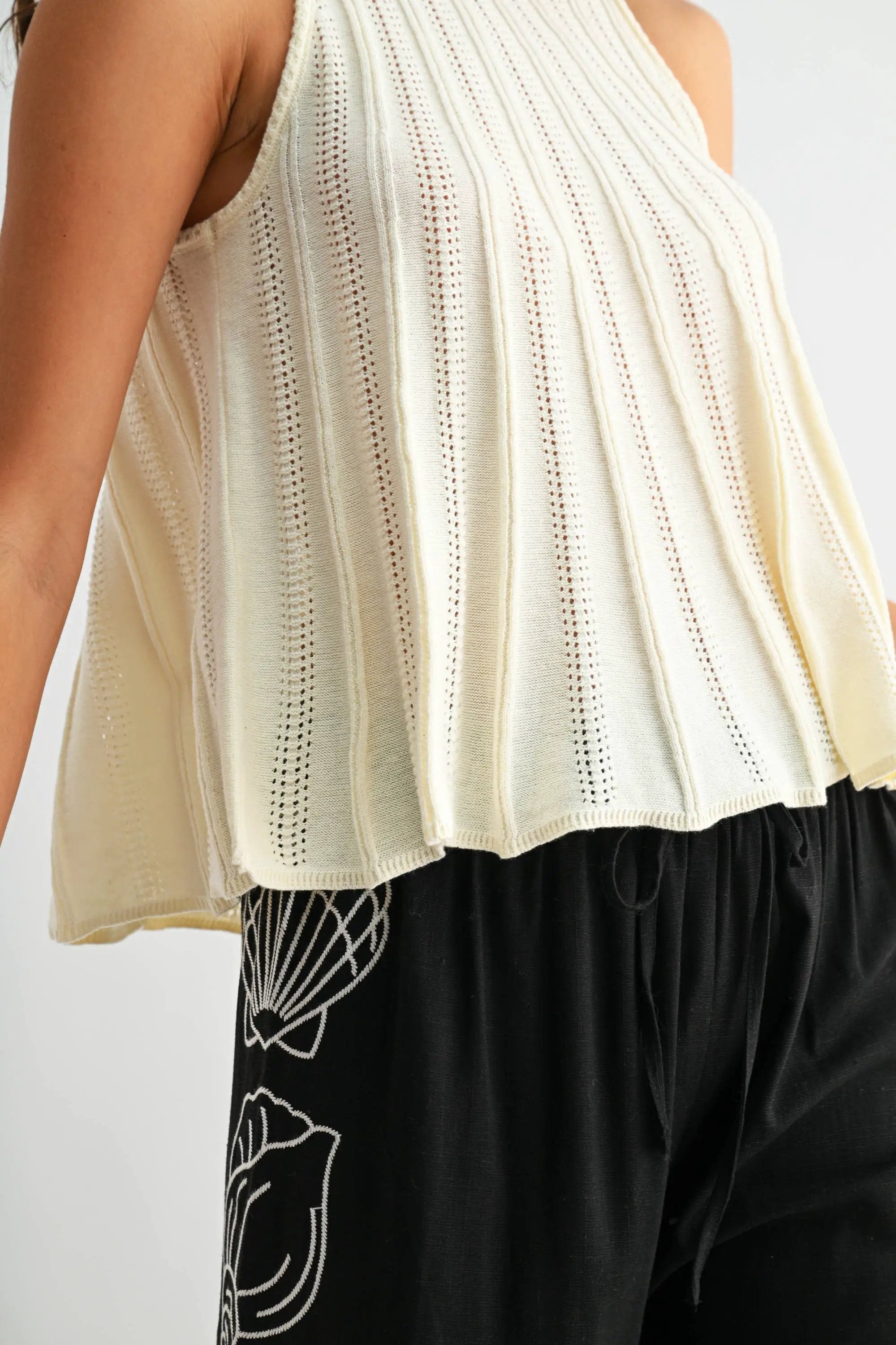 Camellia The Sleeveless Knit Top with Flared Hem: CREAM - Tank Tops