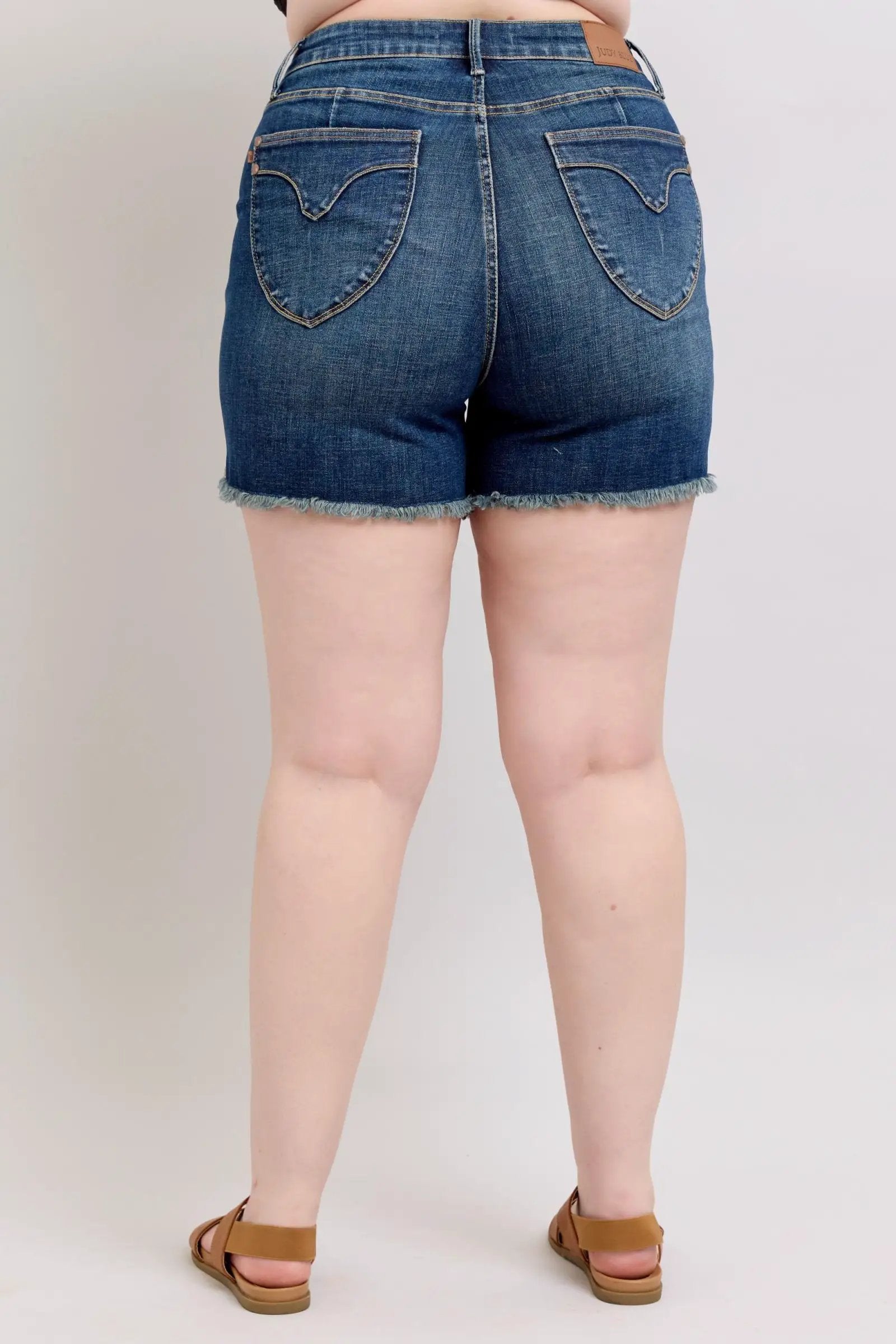 Judy Blue Judy Blue High Waisted Tummy Control Frayed Hem & Shield Back Pocket Dark Blue Denim Shorts PLUS - Shorts Judy Blue High Waisted Tummy Control Frayed Hem & Shield Back Pocket Dark Blue Denim Shorts PLUS