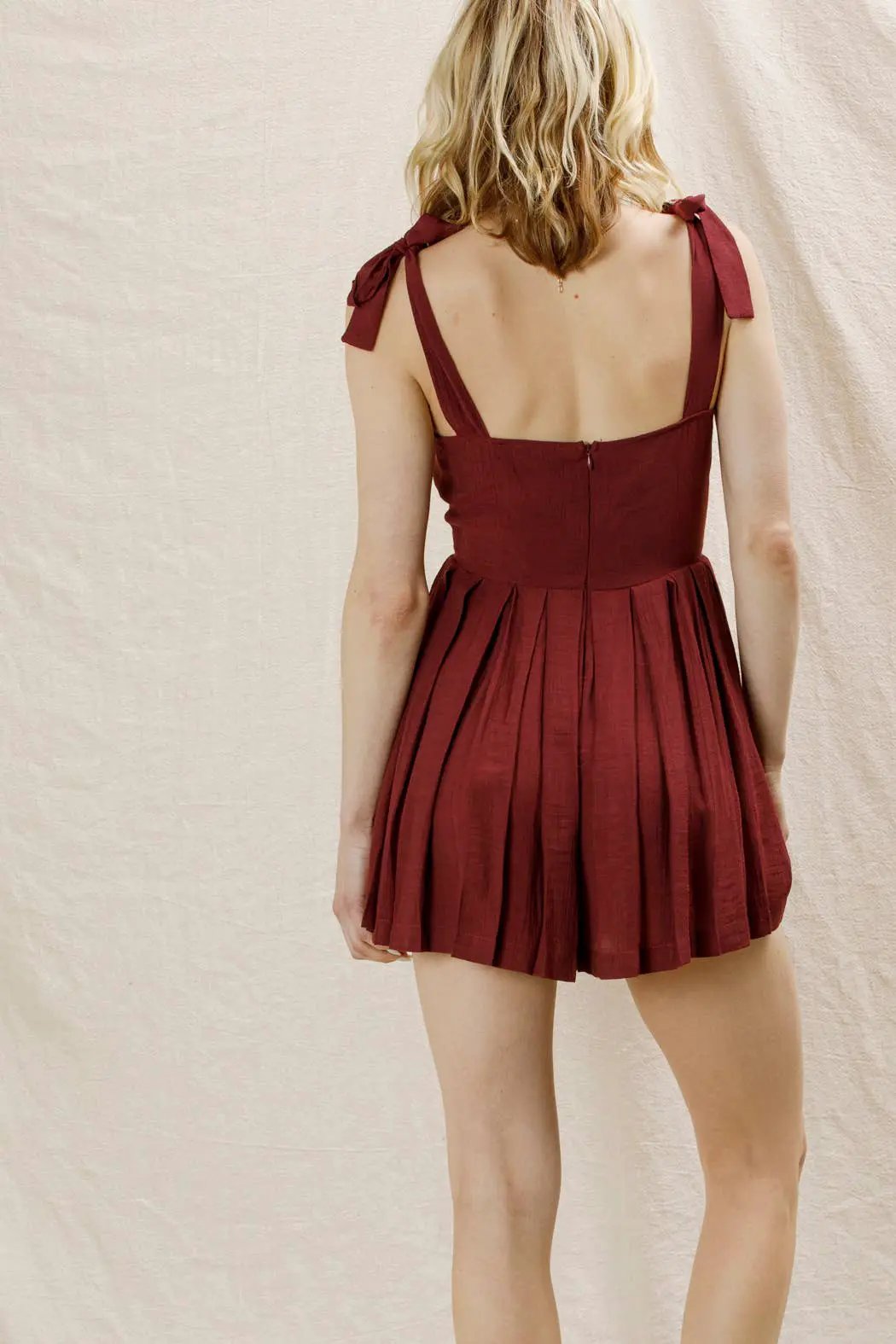 En Crème En Crème Wine Shoulder Tie Pleated Romper - One-Pieces shoulder tie pleated romper