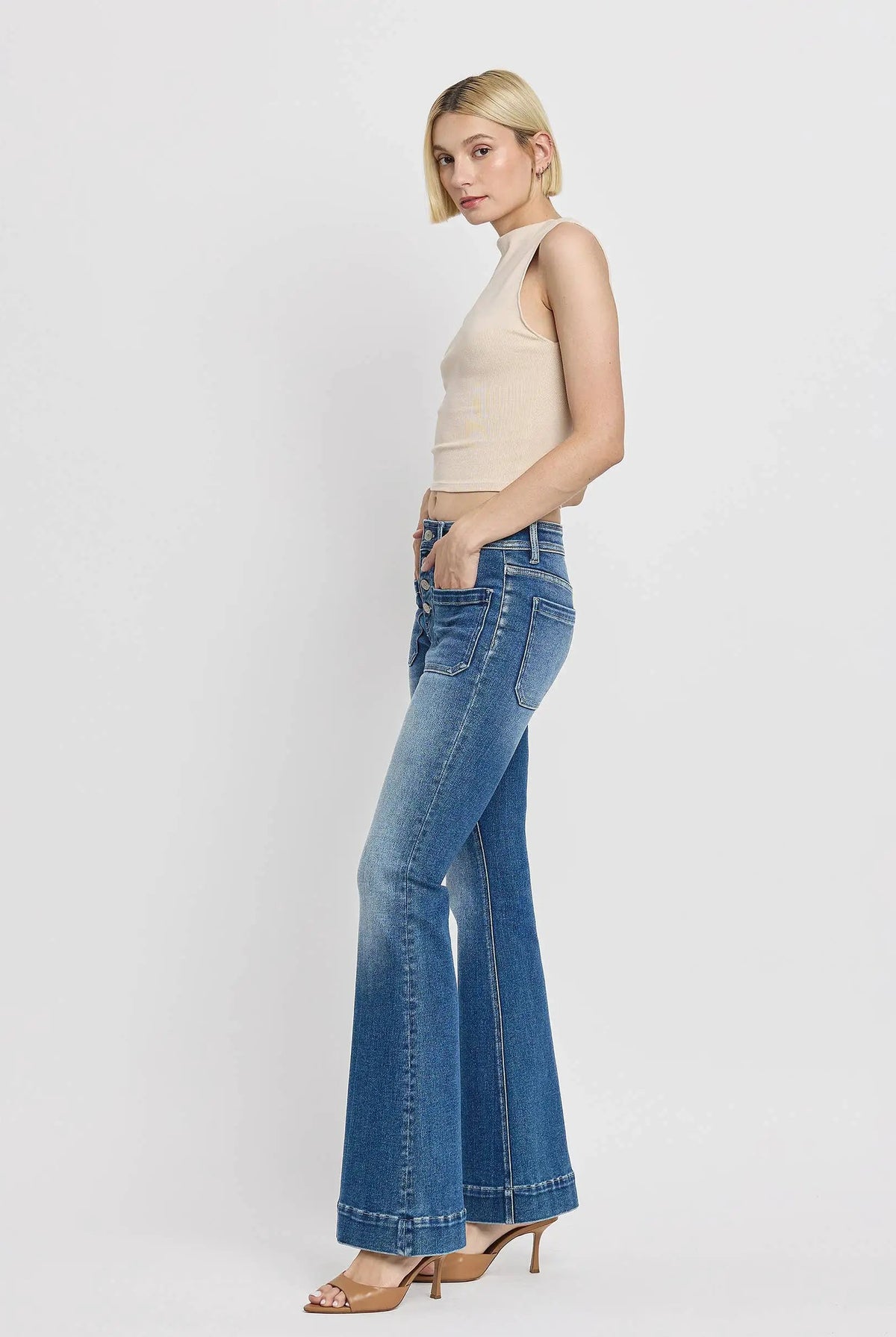 Vervet Alison flare jeans in mid-blue featuring a trouser hem and button fly detail