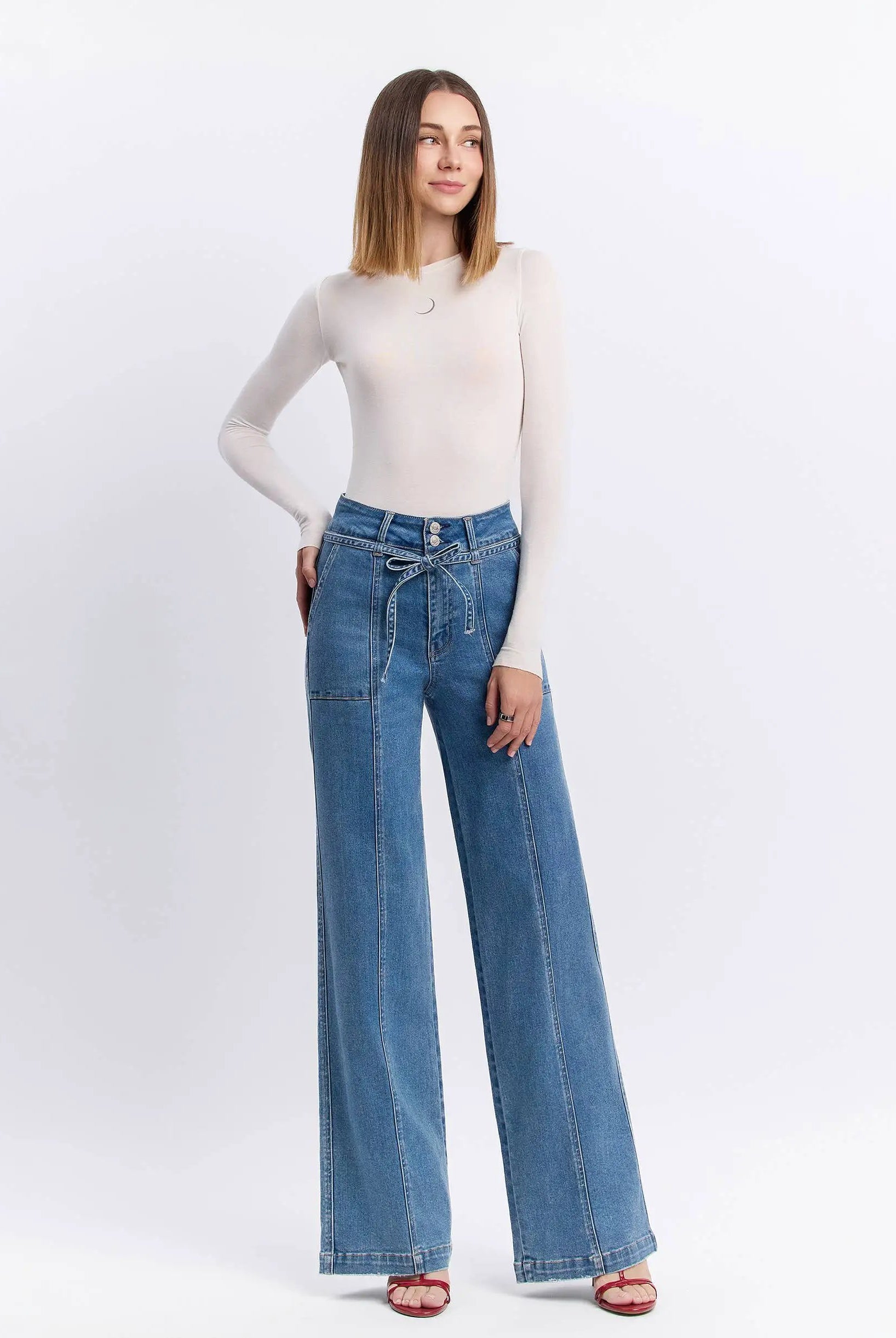 Model wearing Vervet Olivia super high rise wide leg tie waist jeans