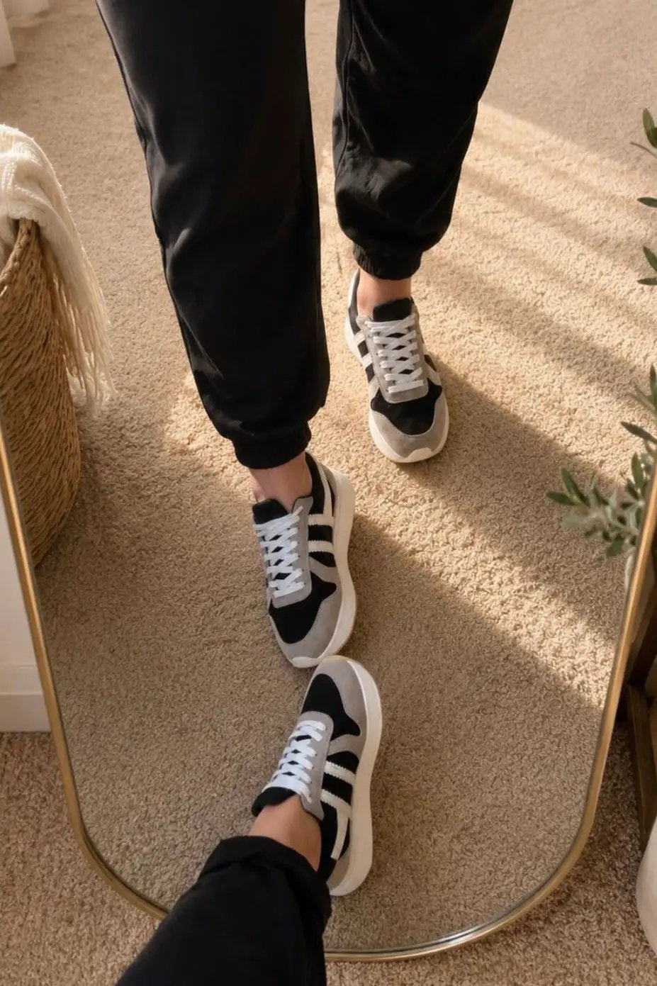Pair of Maker's Shoes Ace 6 women's sneakers in black with white laces and three white stripes
