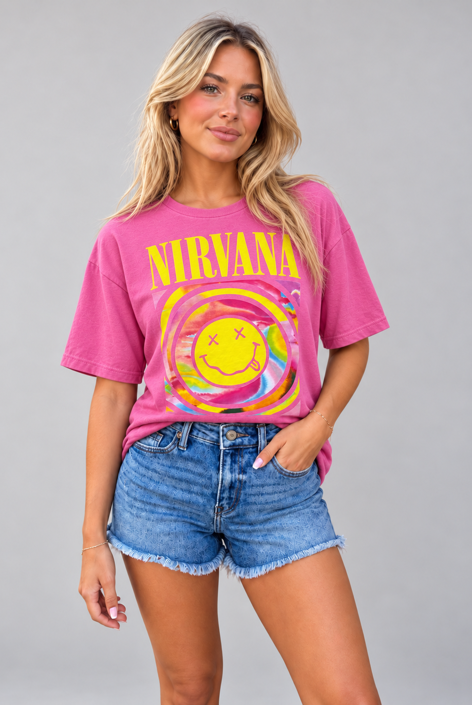 Pink Nirvana graphic tee featuring a rainbow smiley face design, embodying grunge rock style.
