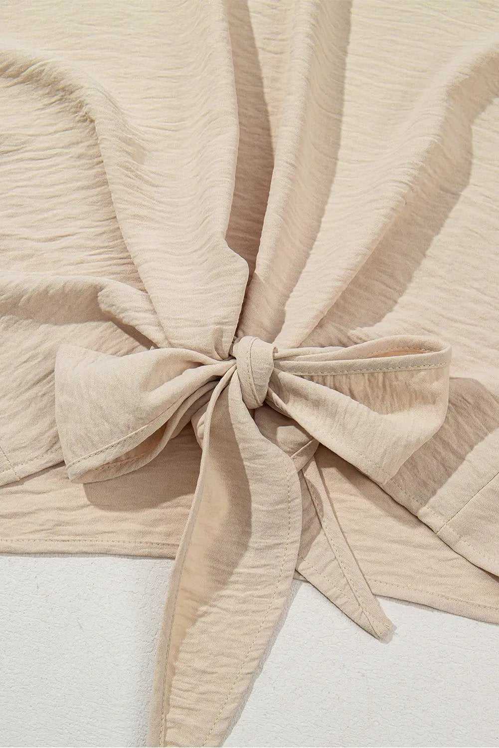 Grateful Threads Boutique Parchment Knotted Hem Short Sleeve Blouse – Effortless Chic Style - Blouses Parchment Solid Color Knotted Hem Short Sleeve Blouse