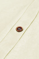 Close-up of cardigan buttons and breathable texture