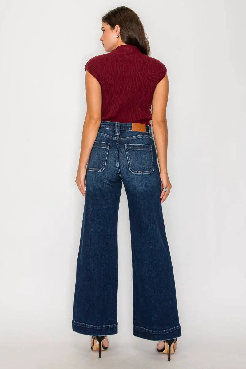 Artemis Vintage tummy-control high-rise A-line wide-leg jeans in dark stone wash, back view.
