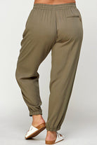 Olive green cuffed jogger pants.