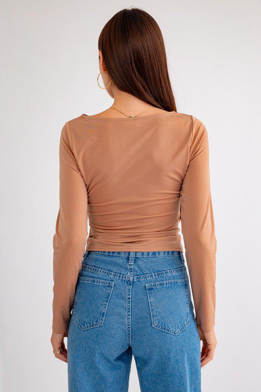 Brown long sleeve top, back view.