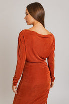 Here's an alt text suggestion for the image: Rust-colored long-sleeve midi dress.