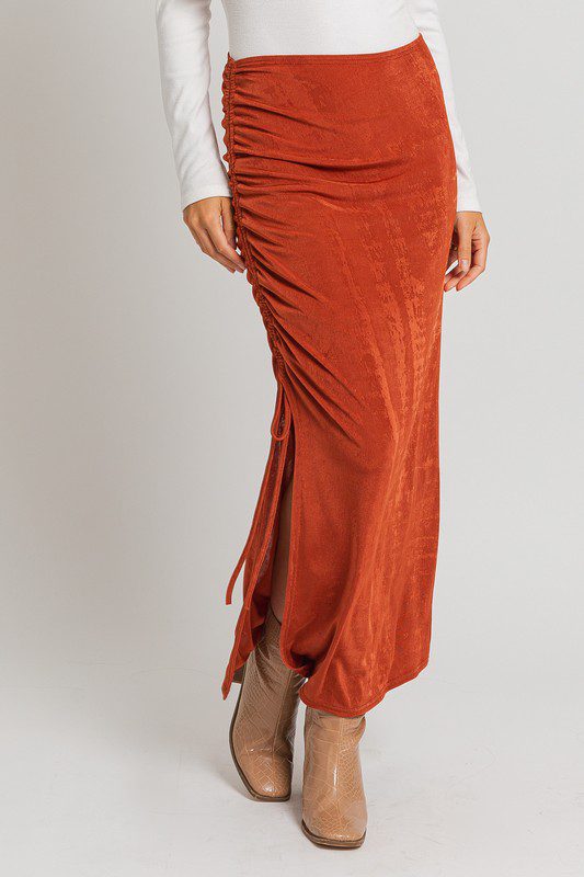 Rust side-tie maxi skirt with boots.