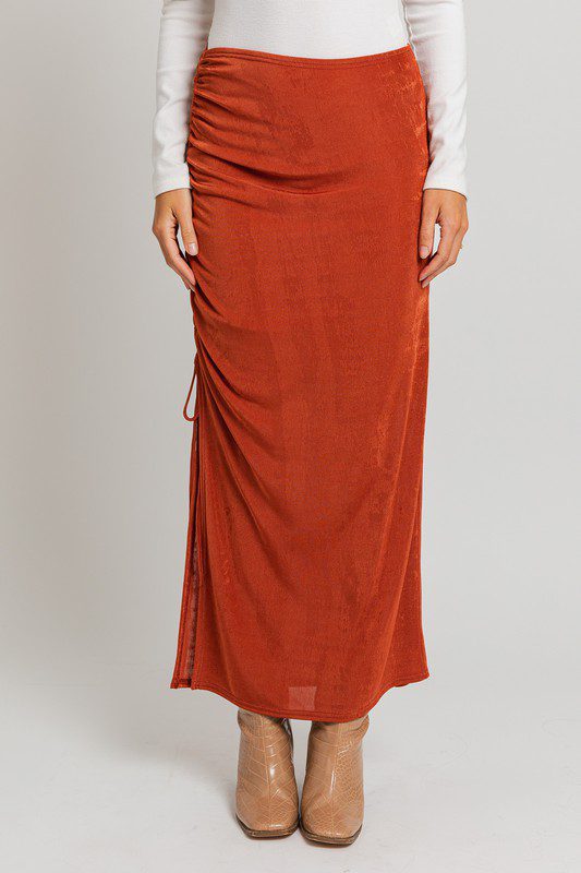 Rust-colored side-slit maxi skirt.