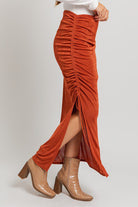 Burnt orange side-slit maxi skirt.