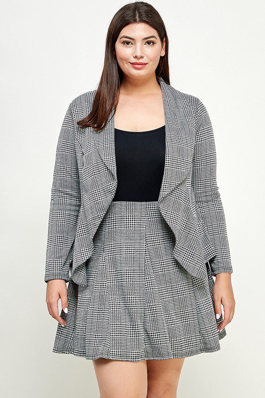 Plus-size woman in plaid blazer and skirt.