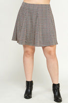 Plaid skater skirt and black boots.