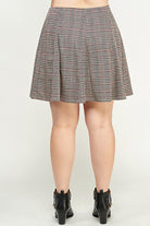 Plaid pleated mini skirt and boots.