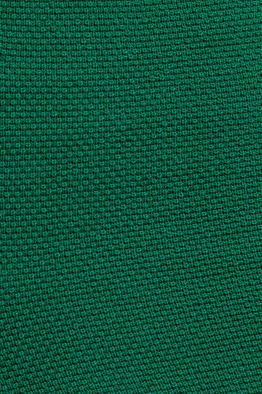 Here's an alt tag for the image: Dark green fabric texture.