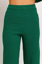 Green knit wide-leg pants.