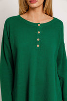 Green waffle knit henley top.