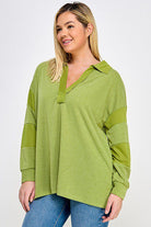 Green collared long sleeve shirt for women.