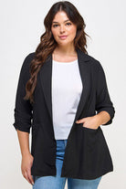 Black blazer, woman, three-quarter sleeves.