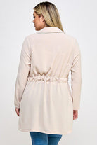 Beige cinched waist long sleeve shirt.