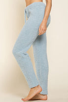 Light blue fuzzy drawstring pants.