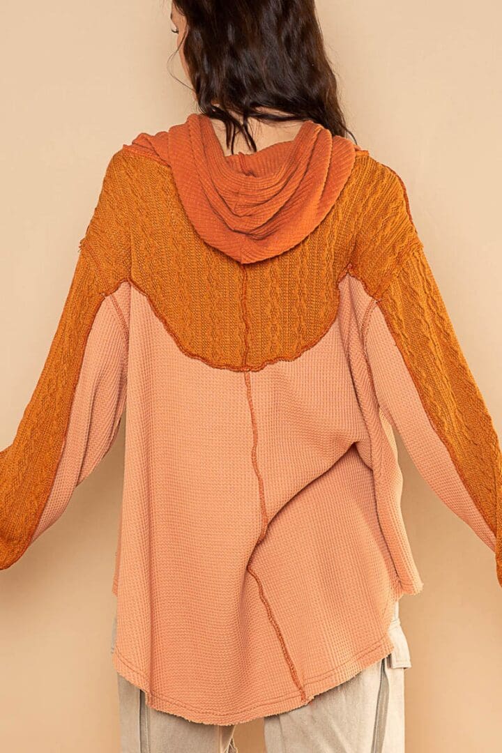 Here's an 8-word alt tag for the image: Back view of a terracotta and peach thermal hoodie.