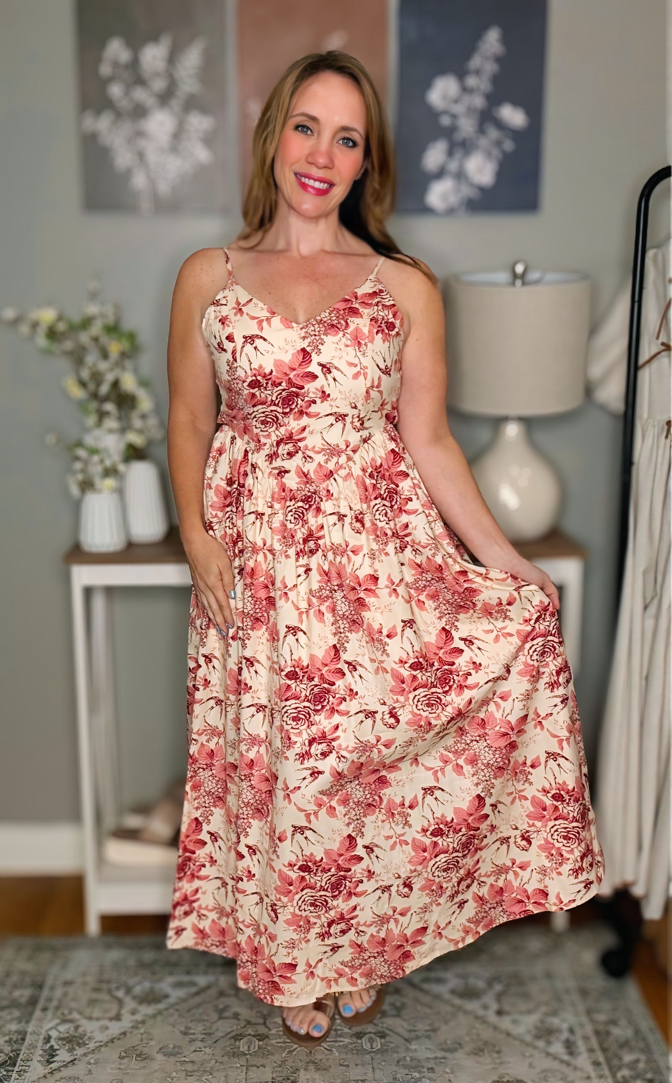 Woman wearing a floral dress in a home setting