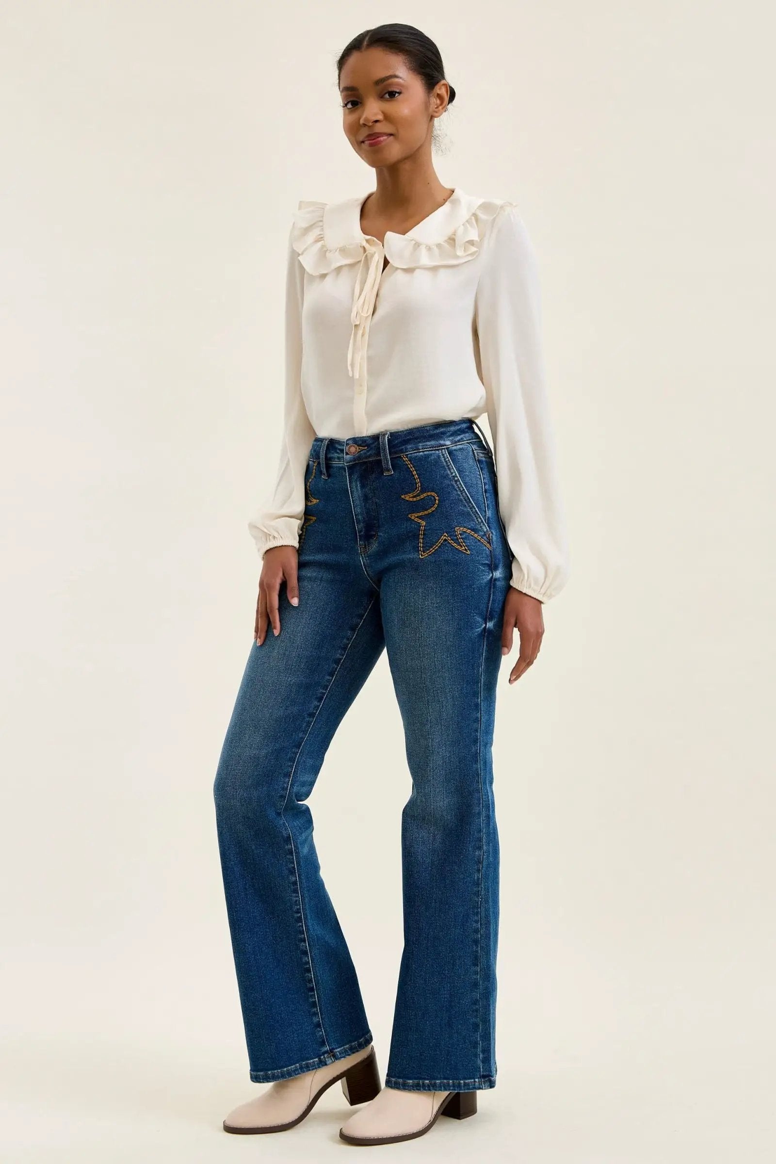 Judy Blue Daisy mid-rise tummy-control bootcut jeans in blue denim with western stitching