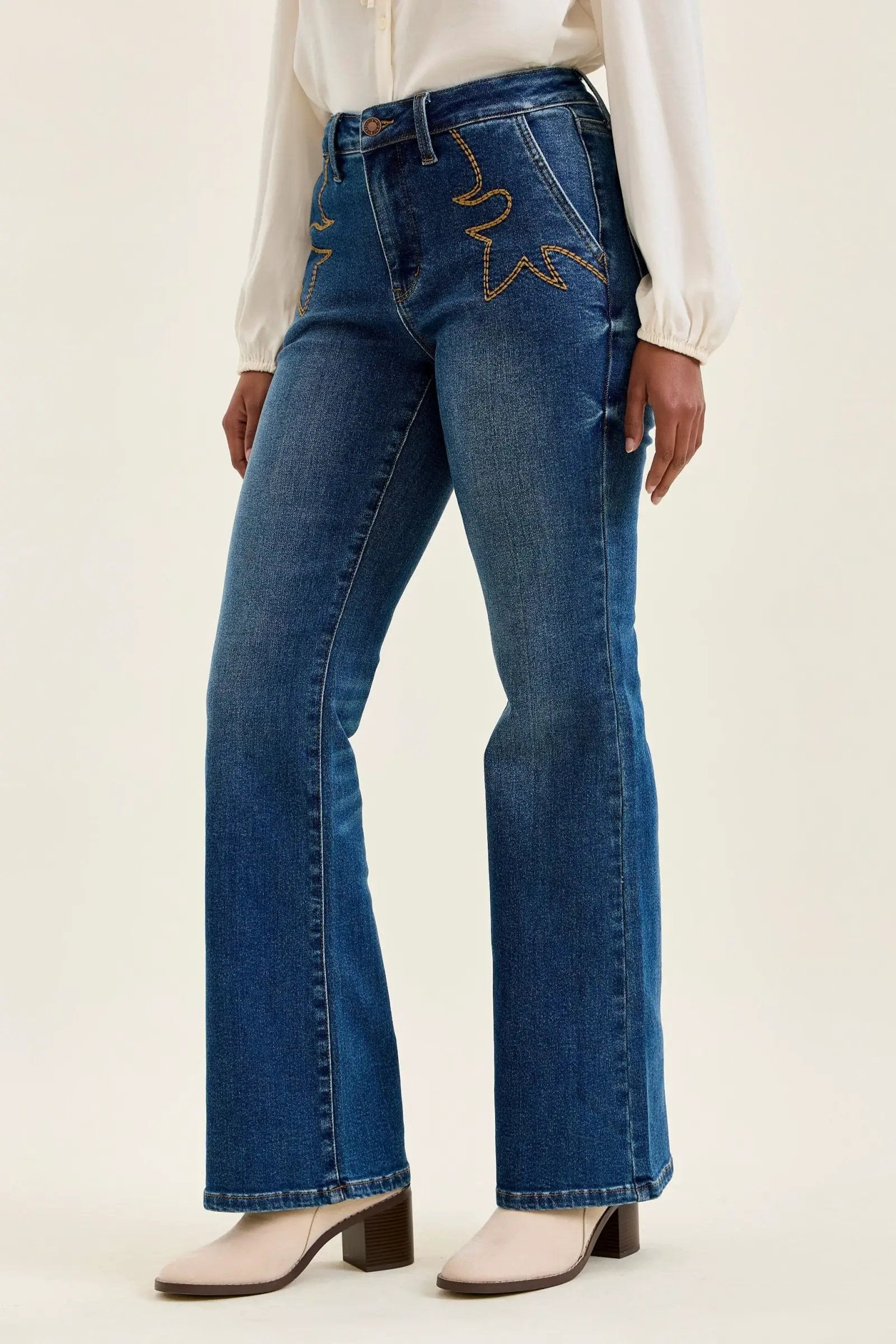 Judy Blue Daisy mid-rise tummy-control bootcut jeans in blue denim with Western stitching.