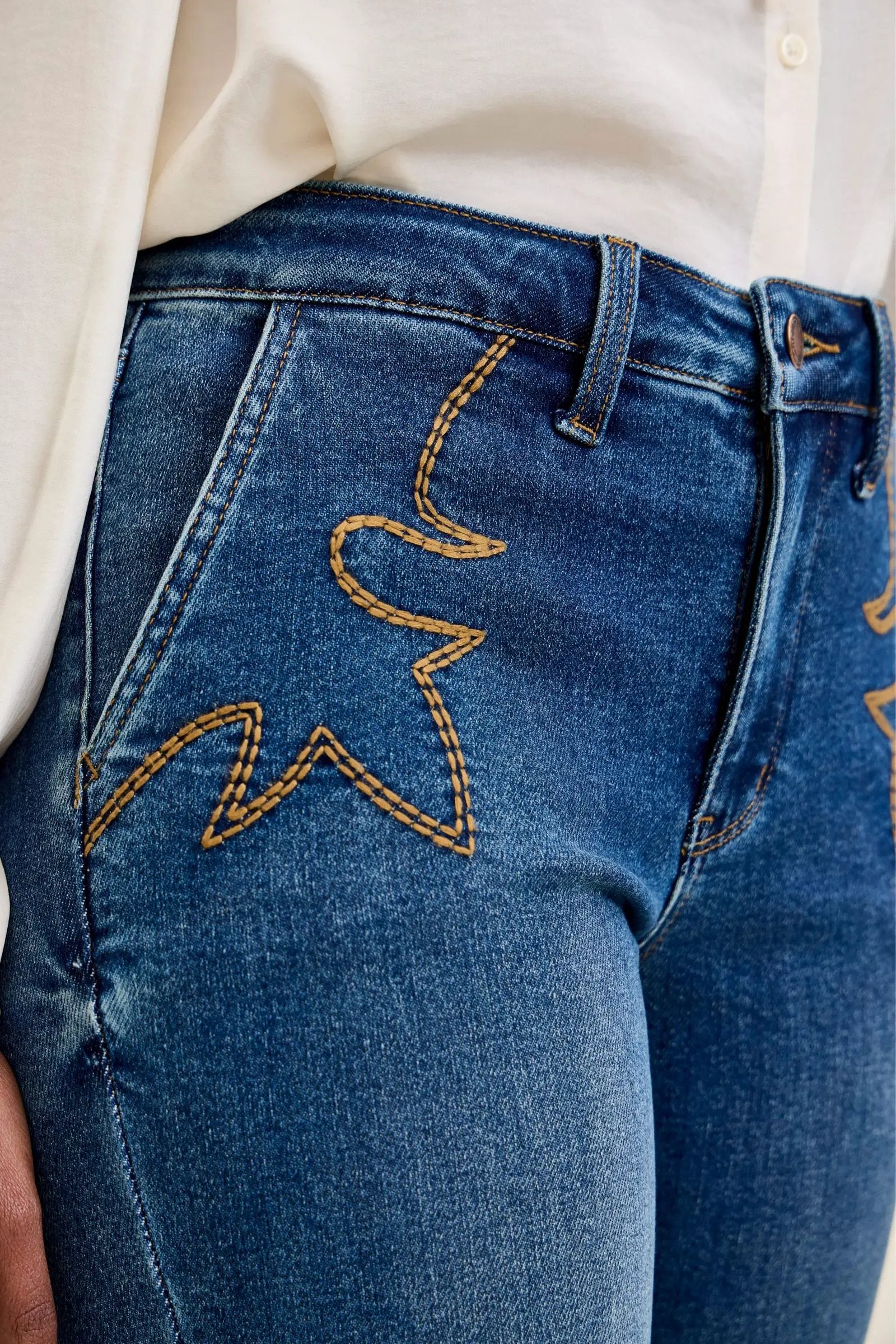Judy Blue Daisy mid-rise tummy-control bootcut jeans in blue denim with gold western stitching