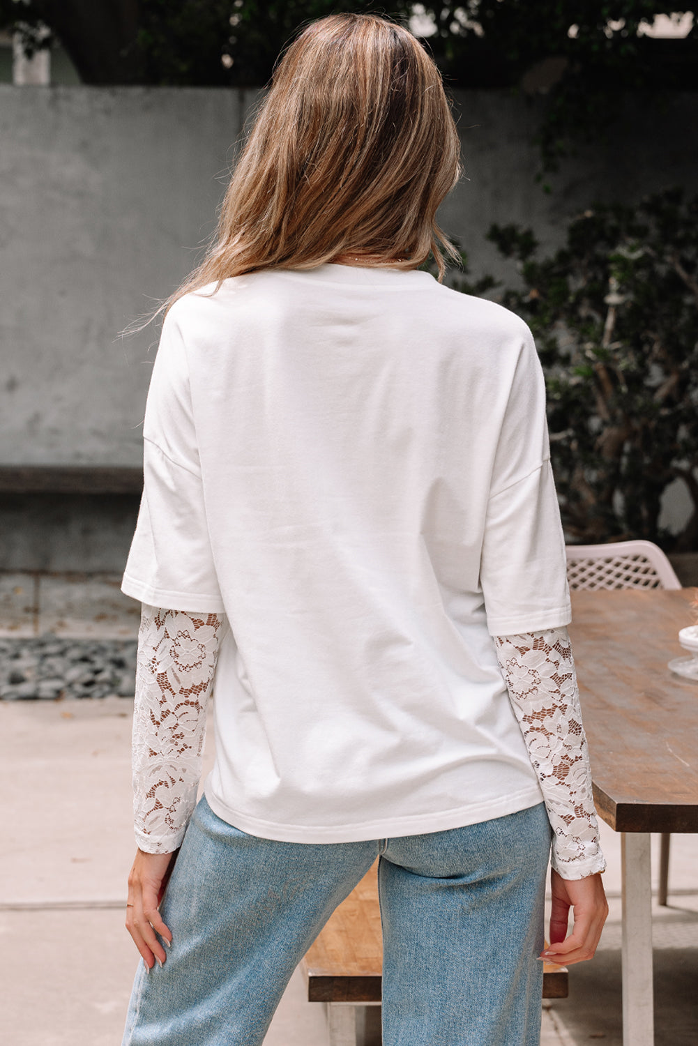 back of white lace sleeve tee with drop shoulder fit on model