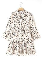 A white and black leopard print dress with ruffle sleeves.