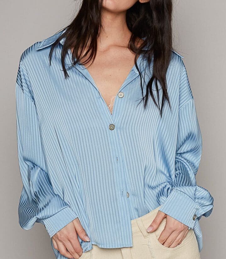 Light blue ribbed button-down shirt.