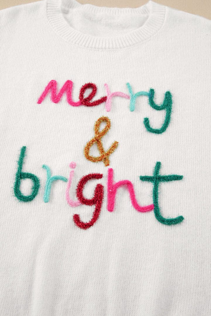 A close up of the words merry and bright